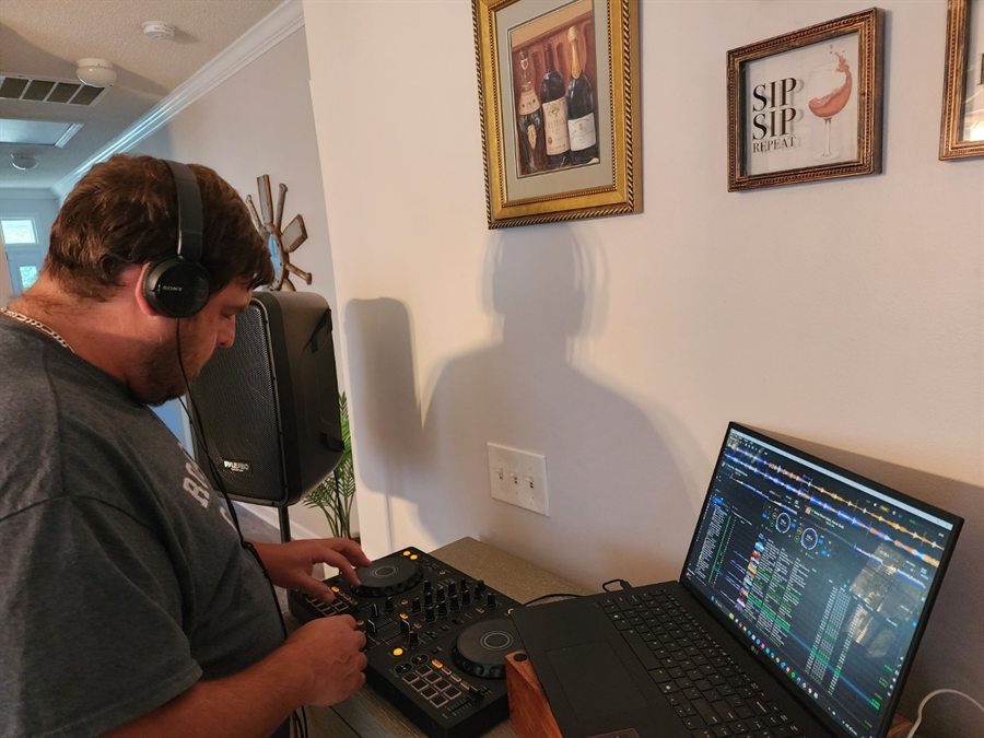 DJ Tony Tone practicing for the Outdoor Glow Party